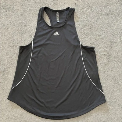 Camiseta sin mangas para correr Adidas Primeblue negra blanca con ribete atlético para mujer talla pequeña Foto 1 de 4