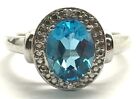 Sterling Silver Oval Swiss Blue Topaz - Cz Accent Dotted Halo Cocktail Band Ring