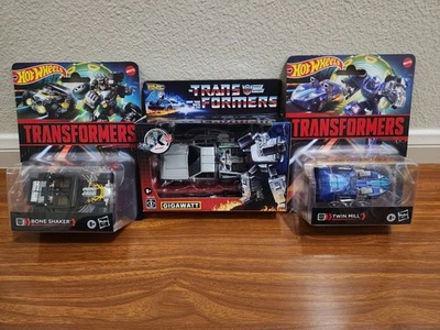Transformers Regreso al Futuro Gigavatio, Hot Wheels Bone Shaker, Twin Mill Lote de 3 Foto 1 de 4