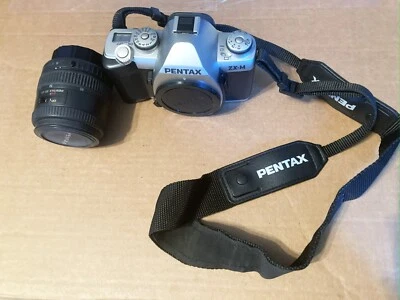 pentax zx-m 35mm film camera, lens, zoom lens, case, flash, film included.  - Image 1 of 4