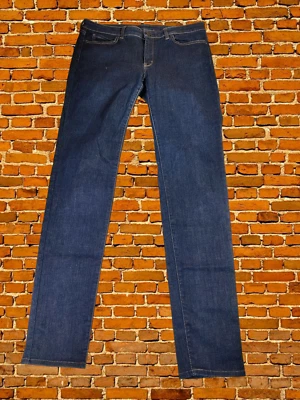 JEANS UNIQLO INDIGO W32 L33 TIRO MEDIO AJUSTADOS CÓNICOS ELÁSTICOS DENIM MUJER 32X33 Foto 1 de 4