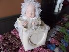 music box, porcelain baby that moves; place for photo! exc cond.!