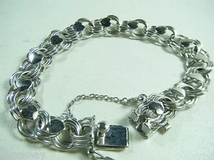 PULSERA DE DIJE DE COLECCIÓN 7/16"" DE ANCHO TRIPLE ENLACE CORAZONES DE LEY 7 3/8"" DE LARGO - Imagen 1 de 5