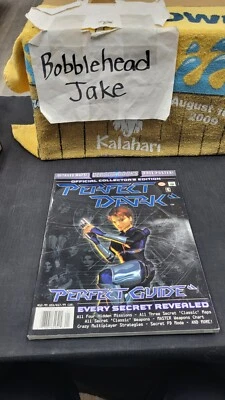 PERFECT DARK NINTENDO 64 VIDEO GAME VERSUS BOOKS STRATEGY GUIDE W/ POSTER - Image 1 of 4