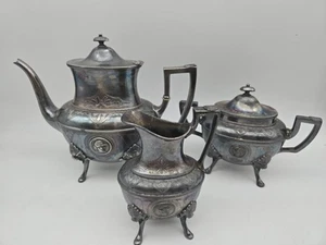 Antiguo juego de tetera plateada figurativa y con patas - Imagen 1 de 9