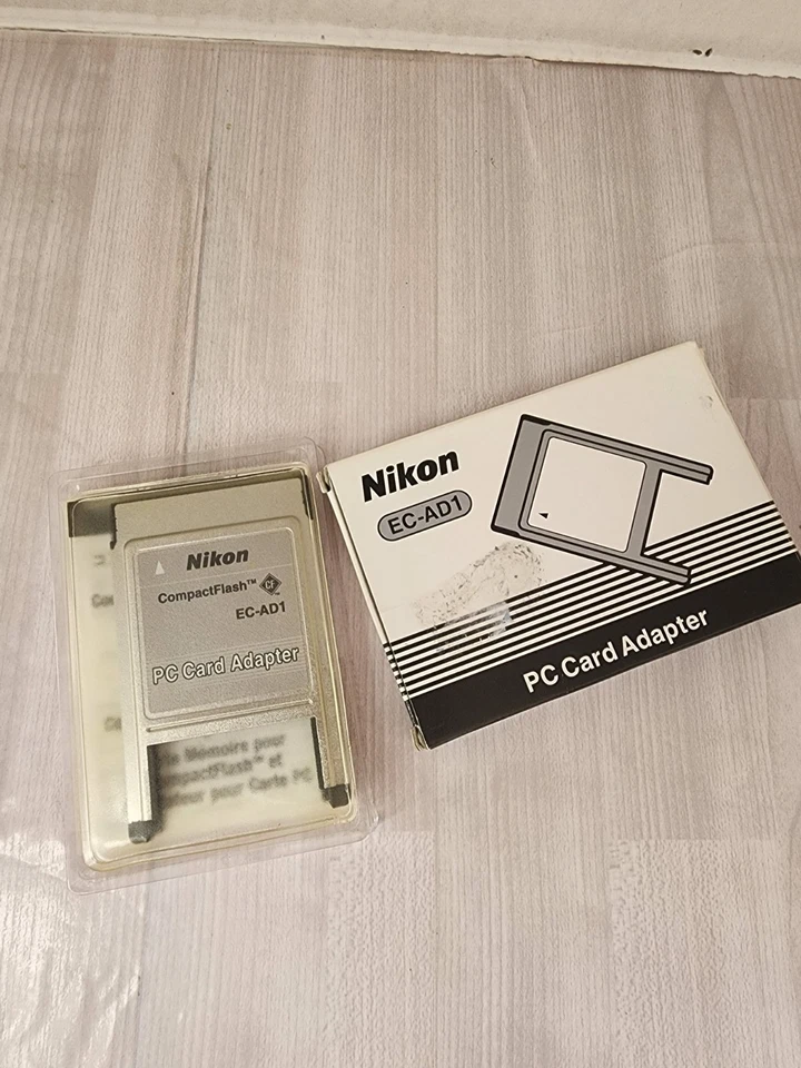 Adaptador de tarjeta de PC flash compacto Nikon EC-AD1 para cámaras digitales Foto 1 de 2