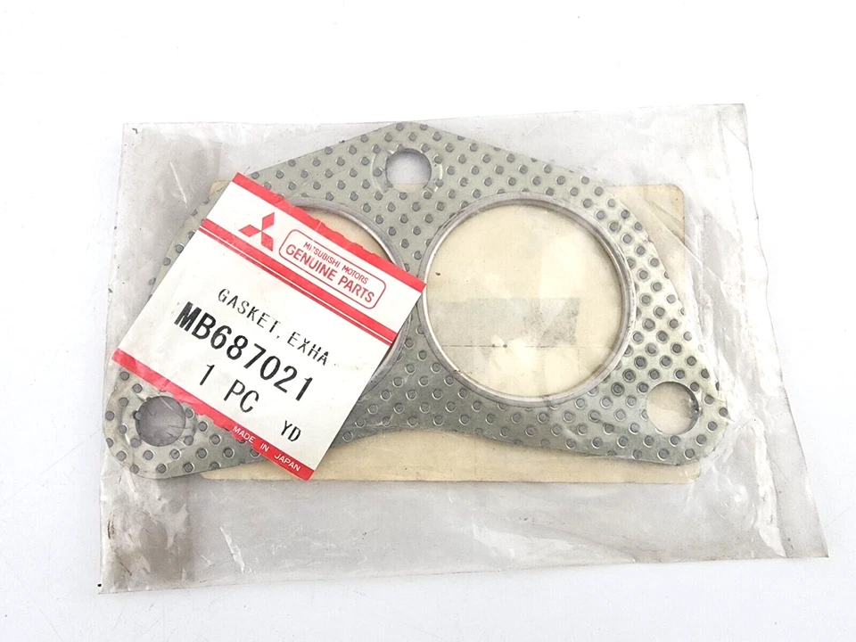Junta de escape original Mitsubishi MB687021 1990-2000 Eclipse 03-06 Outlander Foto 1 de 2