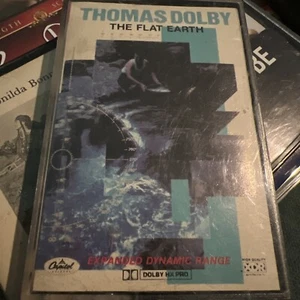 THOMAS DOLBY - THE FLAT EARTH audio cassette, 1984 with "Hyperactive!" synthpop - Picture 1 of 2