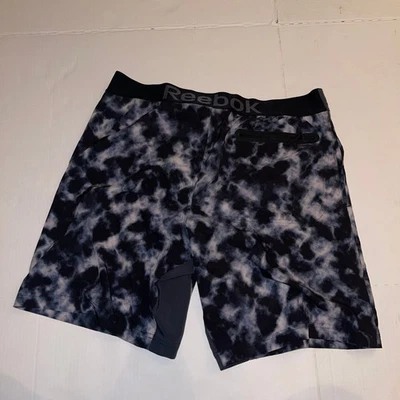 Bañador de playa con bolsillo forrado con estampado ácido negro Reebok para hombre M Foto 1 de 4