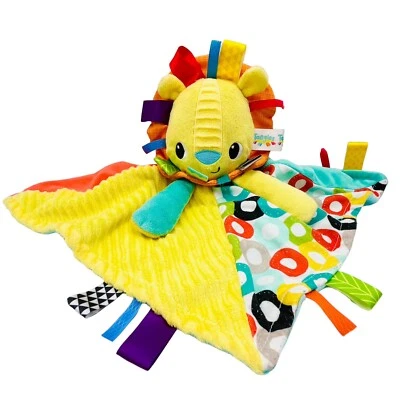 Manta de seguridad de felpa de león amarillo Bright Starts Taggies etiquetas de bebé para niños Foto 1 de 4