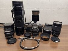Minolta Srt 201 35mm Film Camera w/ Four Lenses And Accessories