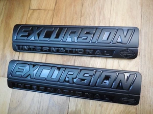 New 2000-2005 Ford Excursion International Front Fender Emblems Black - Picture 1 of 2