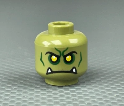 LEGO Olive Green Orc Minifigure Head Yellow Eyes Frown White Fangs Series 24 - Image 1 of 4