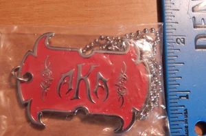 AKA AMERICAN KICK ASS CIGAR CIGARS METAL DOG TAG RED & SILVER 2 1/2" NEW - Picture 1 of 3