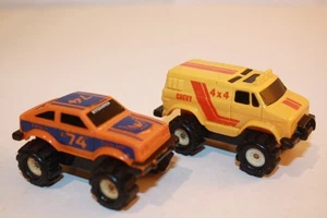 2 Stück McDonalds 1980er Schaper Stomper 4X4 Trucks Chevy Van / AMC Eagle - Bild 1 von 7