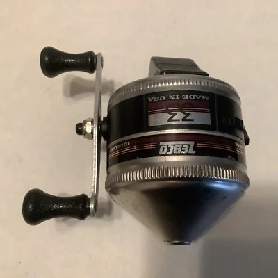 CARRETE SPINCASTING CARA CERRADA A RAYAS MARRONES ZEBCO #33 VINTAGE HECHO EN EE. UU. Foto 1 de 4