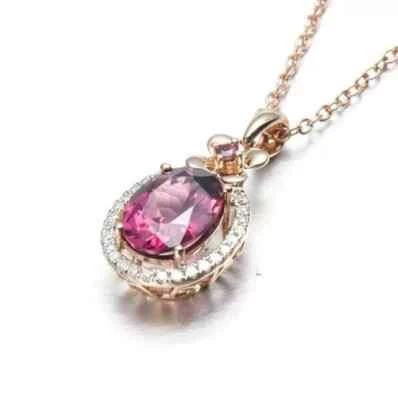 Collar colgante con halo de turmalina rosa de 1,25 quilates de oro rosa de 14 quilates con cadena de 18" Foto 1 de 2