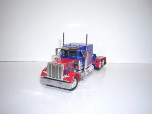 DCP PRIMERA MARCHA 1/64 SADIE RAE AZUL Y ROJO PETERBILT 359 CON CAMA DE 60" - Imagen 1 de 5