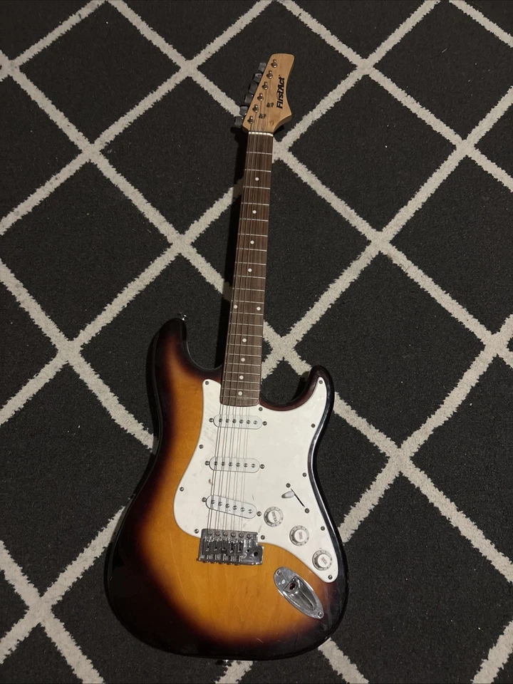 Guitarra FirstAct  Foto 1 de 2