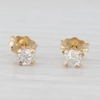 Aretes solitarios redondos de diamantes de 0,23 quilates de oro amarillo de 14 k Foto 1 de 4