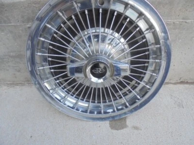 BUICK RIVIERA 15 PULGADAS CABLE RADIOS TAPACUBOS GIRATORIO Foto 1 de 4