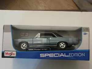 MAISTO SONDERAUSGABE 1/18 1965 PONTIAC GTO HARD TOP DRUCKGUSS NEU IM KARTON - Bild 1 von 8