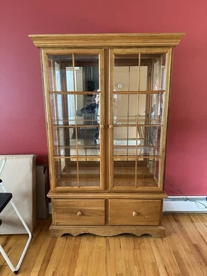 Vtg Ashley Furniture Oak Curio Cabinet W/ Base + Light, mirror shelves 2 drawers - Image 1 of 4