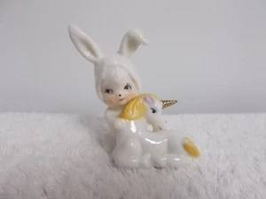 Vintage Child in Bunny Suit Holding Unicorn Porcelain Figurine Statue - Picture 1 of 5
