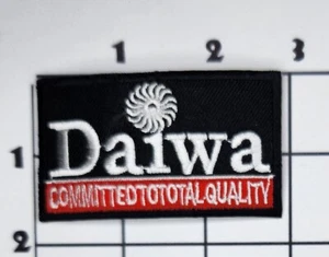 Daiwa Aufnäher Qualität verpflichtet schwarz bestickt Bügelbild Uniform - Bild 1 von 1