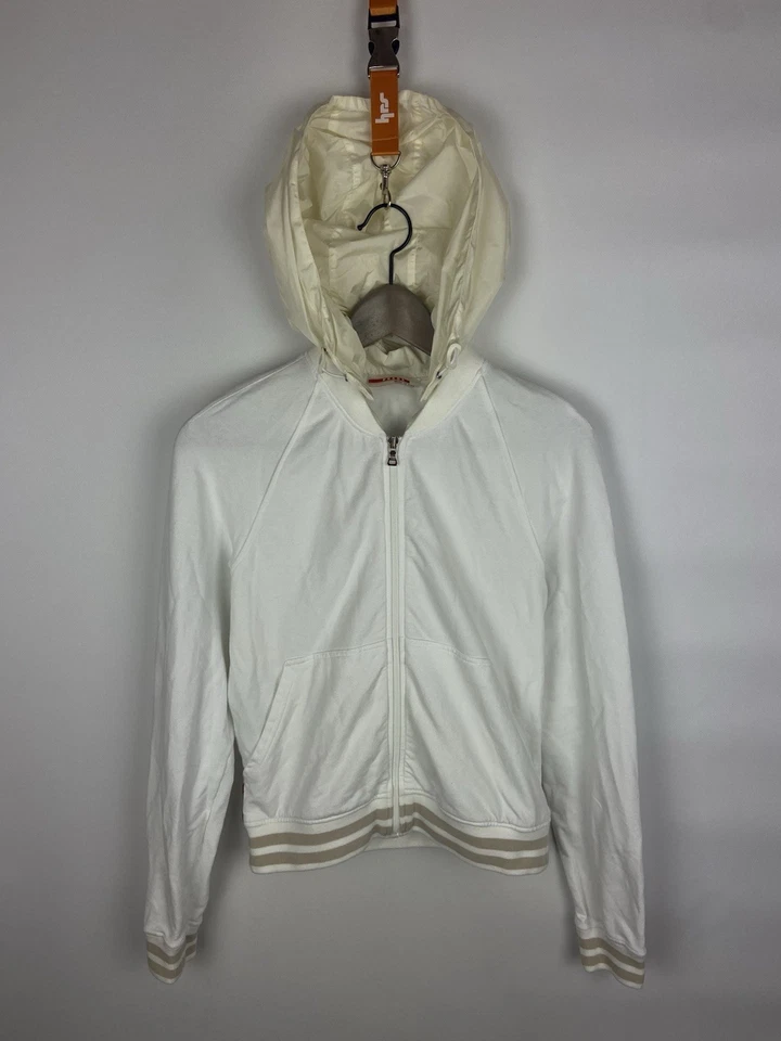 Chaqueta cortavientos con capucha y cremallera blanca vintage Prada para mujer talla S Foto 1 de 4