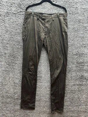Pantalones cónicos satinados de tiro medio Acne Studios Max verdes para hombre talla 50 Foto 1 de 4