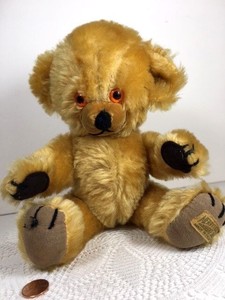 Vintage Merrythought Cheeky teddy bear, damaged left ear. 10" five jointed.
