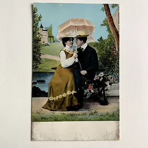 Vintage Couple Sitting on Bench Posted Postcard - Picture 1 of 3
