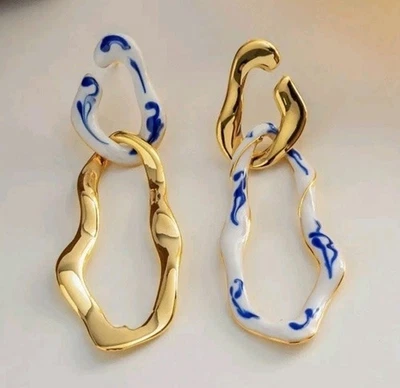 Pendientes asimétricos de oro blanco azul Anthropologie  Foto 1 de 3