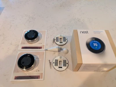 Two Nest 1st Generation Learning Silver Programmable Thermostats - Image 1 of 4
