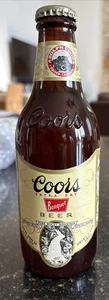 Bottiglia ibrida Coors Birra Steinie collo corto extra secca vintage .con corona - Foto 1 di 6