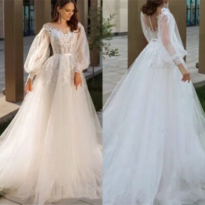 Elegantes vestidos de novia de línea A con cuello en O con mangas abullonadas y apliques de encaje vestidos de novia Foto 1 de 4