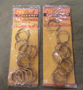 #D331. TWO PACKETS OF NOCK & KIRBY'S METAL CURTAIN RINGS - Picture 1 of 2