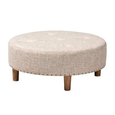 Mesa de centro otomana Baxton Studio Vinet de tela acolchada y madera en beige Foto 1 de 4