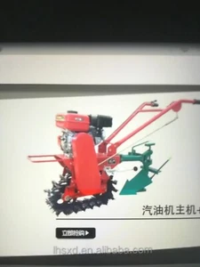 Gartenpflug mit Benzinmotor und Mittel-Raupenfahrwerk Und Zusatzgeräte. - Bild 1 von 2