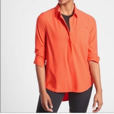 Athleta orange hidden placket button front long sleeve shirt. - Image 1 of 4