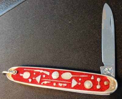 Cuchillo bolígrafo deportivo olímpico vintage dorado de 3" con asas rojas con fianza Foto 1 de 4
