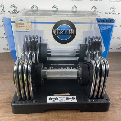 Juego de mancuernas ajustables Stamina Versa Bell de 5 a 25 libras con soporte y caja Foto 1 de 4