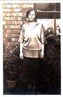 R38.Vintage Postcard. Unknown Woman in front of her house. Blouse.