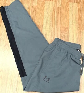 PANTALONES CORTAVIENTOS UNDER ARMOUR HOLGADOS POLIÉSTER GRIS Y NEGRO ALTOS X-GRANDES, XLT - Imagen 1 de 6