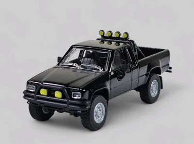 Toyota Hilux SR5 1985 camioneta pickup coleccionable modelo fundido a presión 1:64 negra suelta Foto 1 de 4
