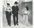 1987 Press Photo Nancy Mike and Bill Miller walk with an English Bobby in Alaska
