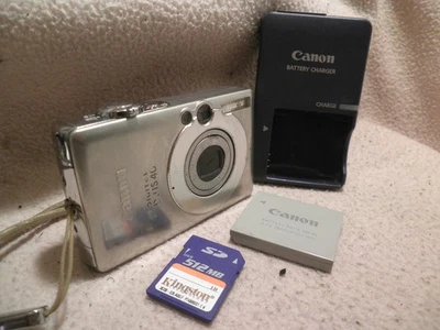 FOTOCAMERA DIGITALE CANON VINTAGE IXUS 40 BUONE CONDIZIONI NO BATTERIA - Immagine 1 di 4