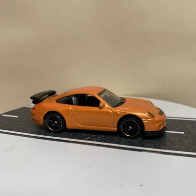 2013 Matchbox On A Mission #1/120 Porsche 911 GT3 Orange Metallic 1:64 NM - Image 1 of 4