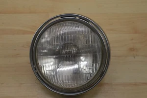 76 Kawasaki KZ400s, 74-78, OEM sealed beam with trim and hardware - Picture 1 of 9